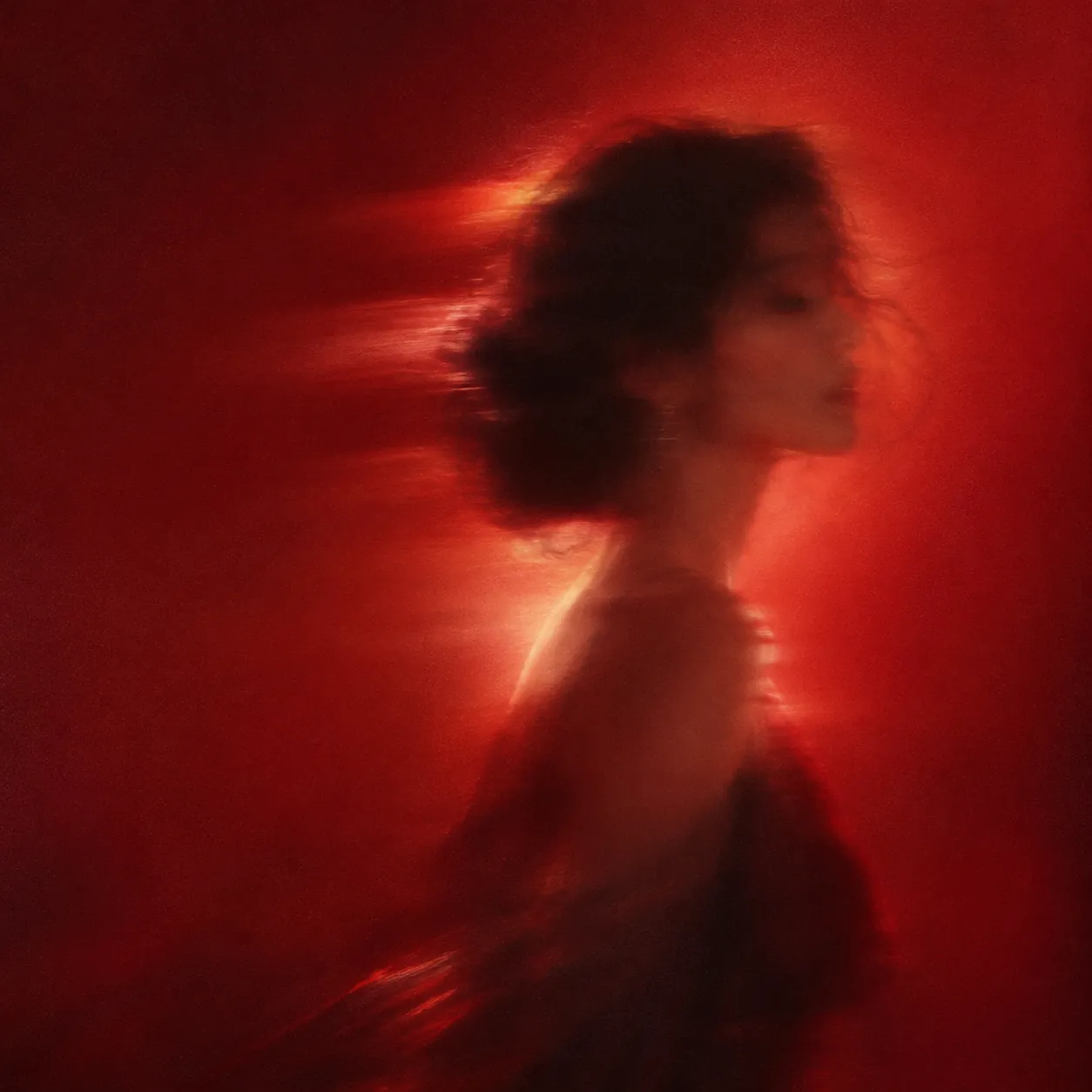 Blurred silhouette of a woman in profile with motion trails, dissolving into a glowing deep red hazy background with film grain