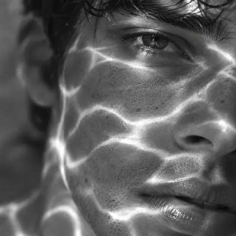 Black-and-White Sunlight Ripple Close-Up Portrait